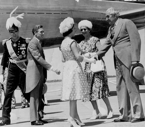 "WE MEET AGAIN": Premier Alexander Bustamante greets Princess Margeret on her arrival from London at the Palisadoes International Airport for Jamaica's Independence Celebrations. Her Husband, Lord Snowdon (in morning coat) awaits his turn with outstretched hand to be greeted by the Premier. At extreme left is Governor, Sir Kenneth Blackburne. © The Gleaner